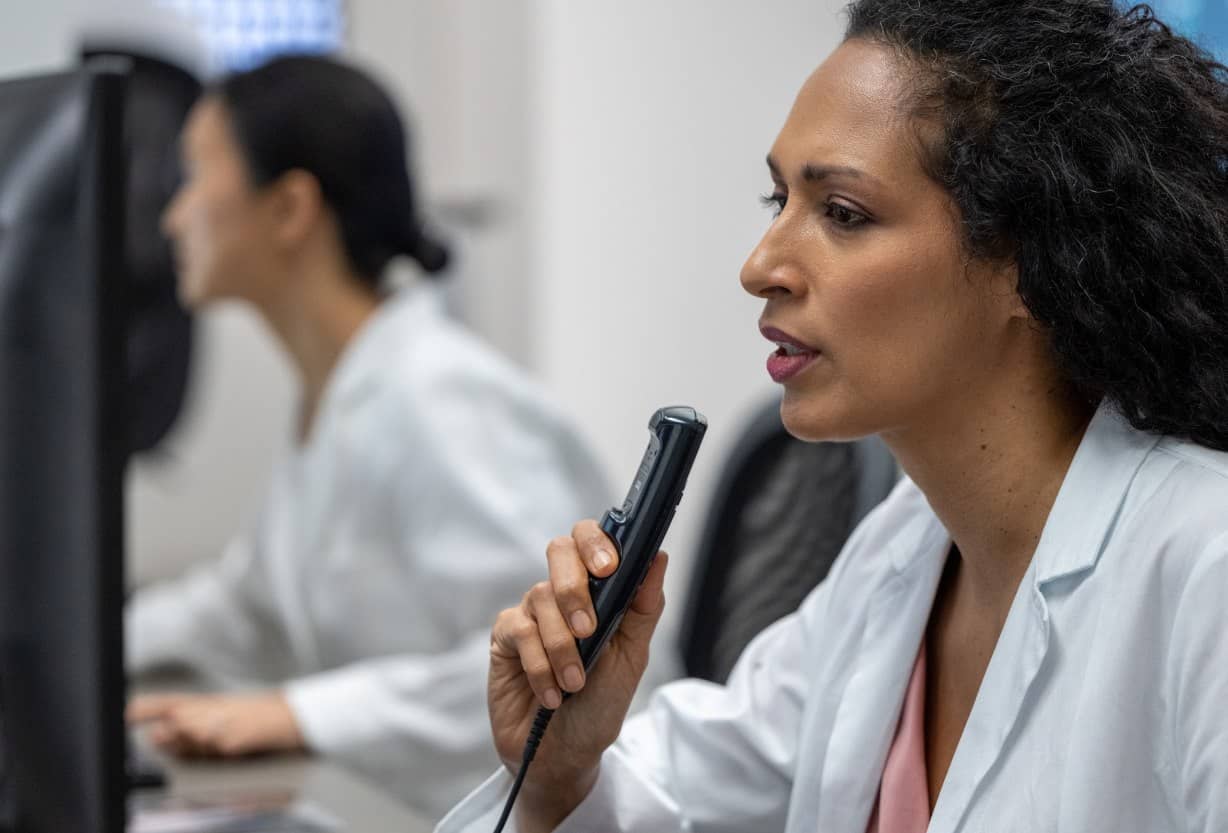 Female-radiologist-dictation-recorder-looking-at-MRI-scan-opt